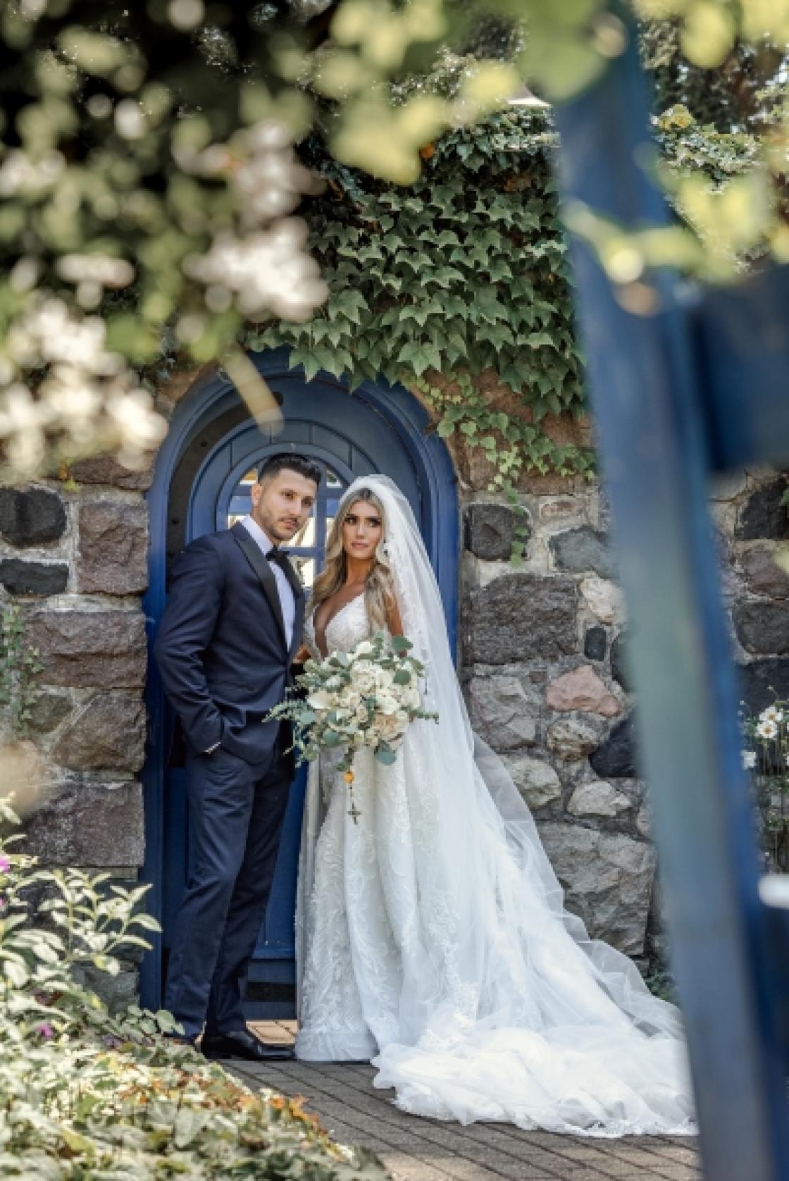 Photo of a bride in groom in the Cranbrook House & Gardens Sunken Garden.