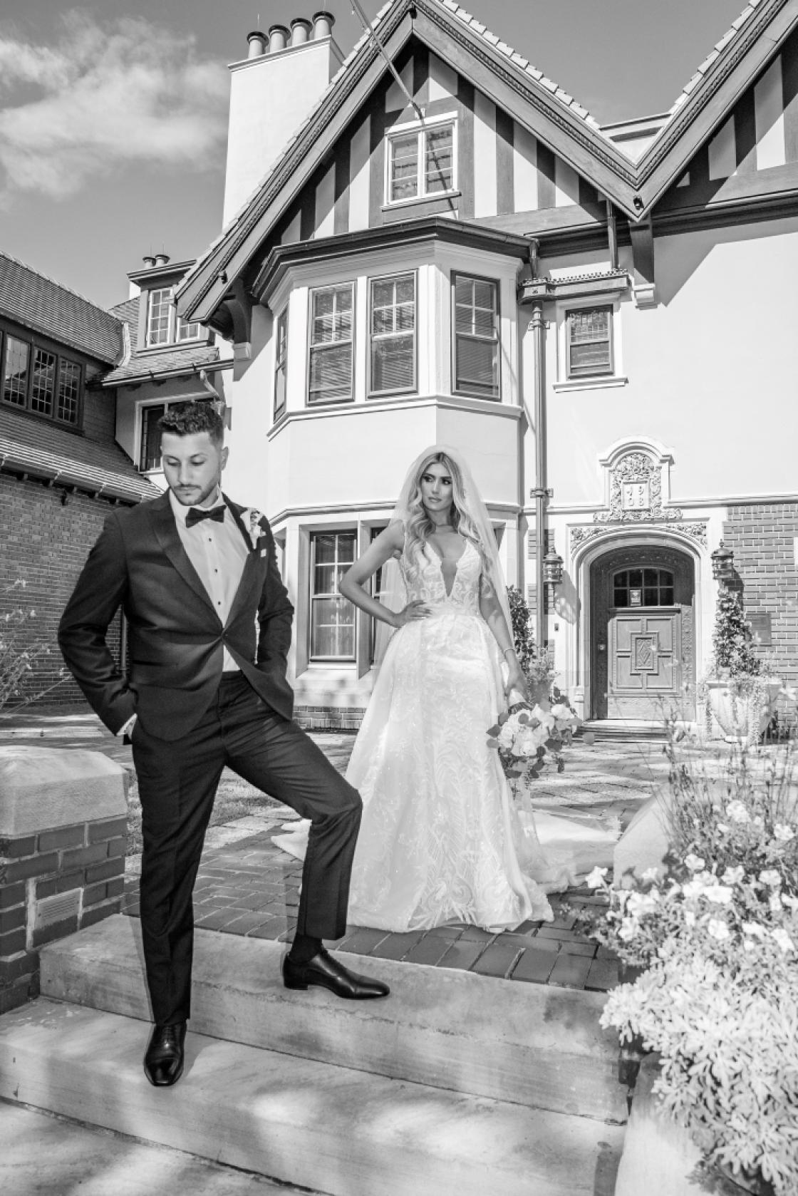 Photograph of a bride and groom in the Cranbrook House Courtyard.