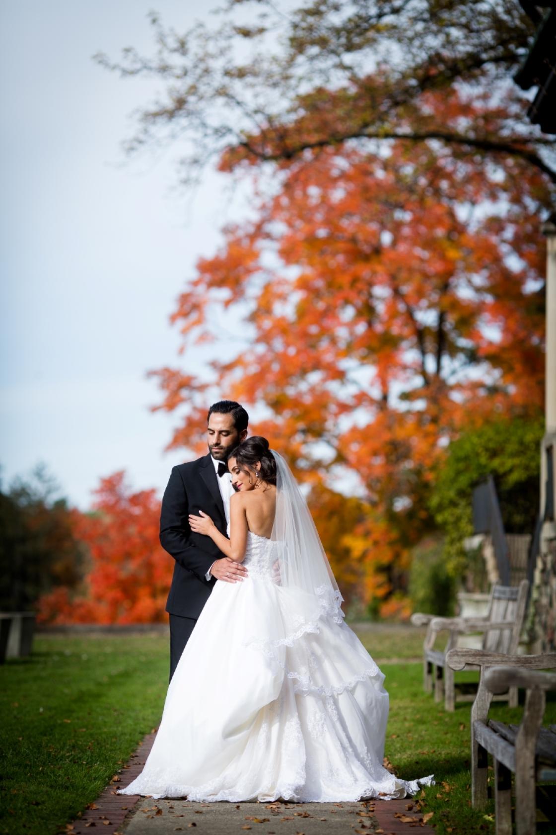 Portrait of two guests at Cranbrook Gardens in the fall. 