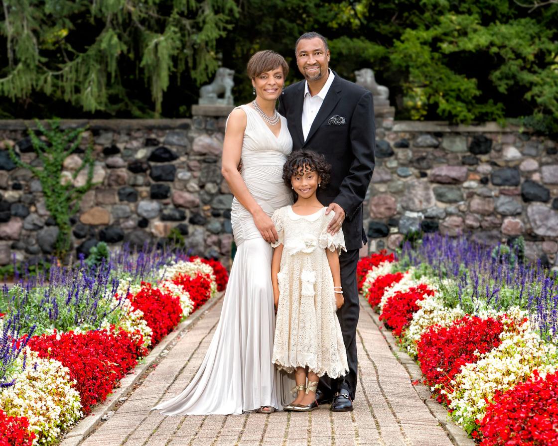 Portrait photograph of a family in the Sunken Garden.