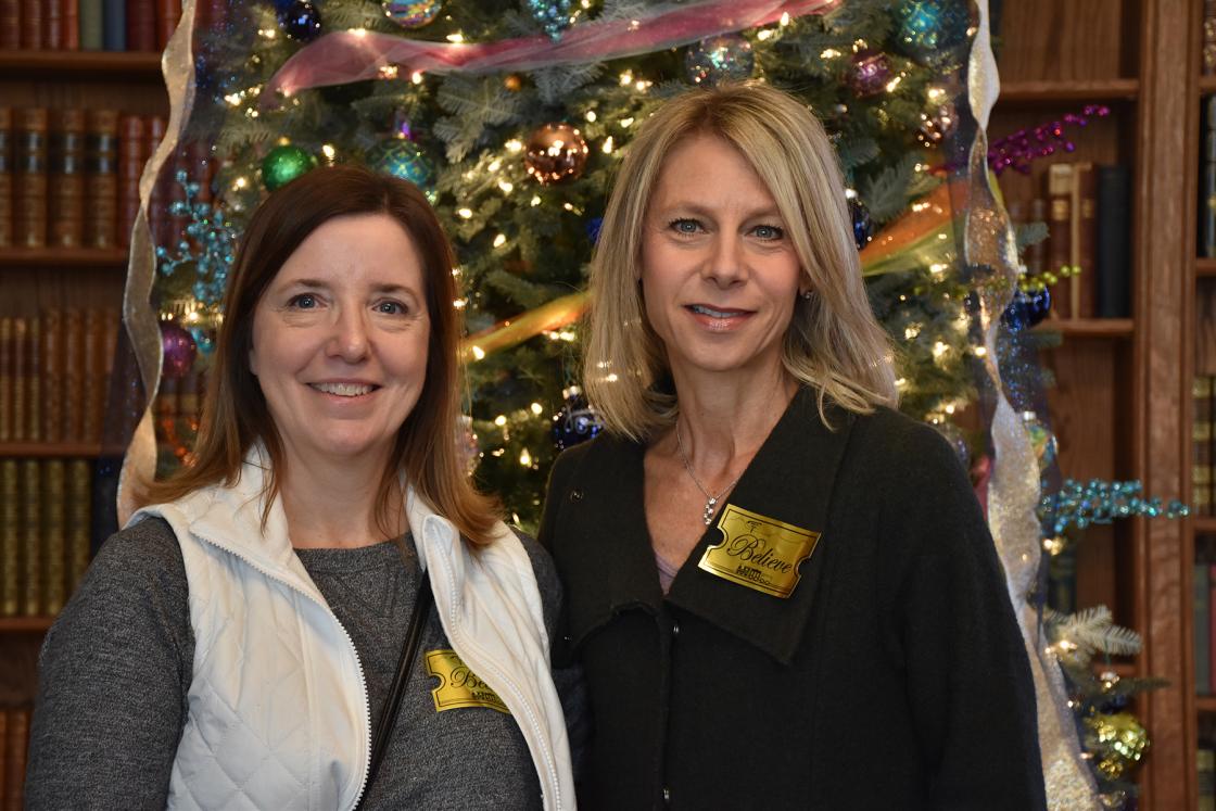 Photograph of two women at Holiday Splendor 2017 in Cranbrook House.