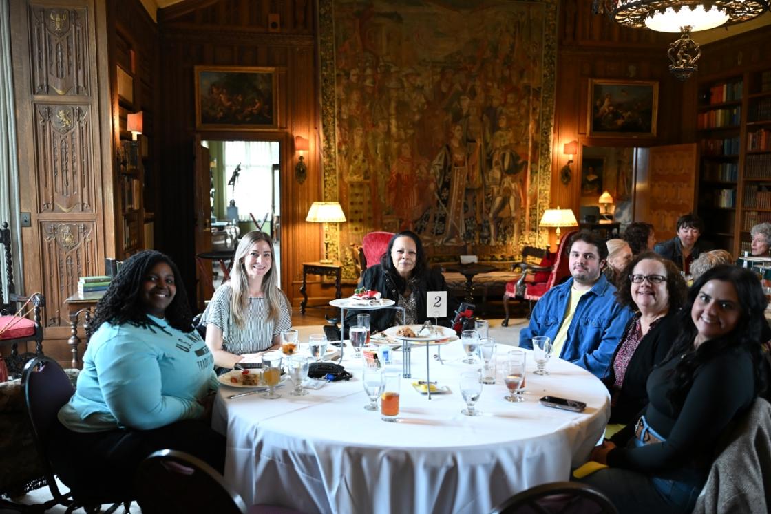Photo of visitors in the Cranbrook House Library during a tea.