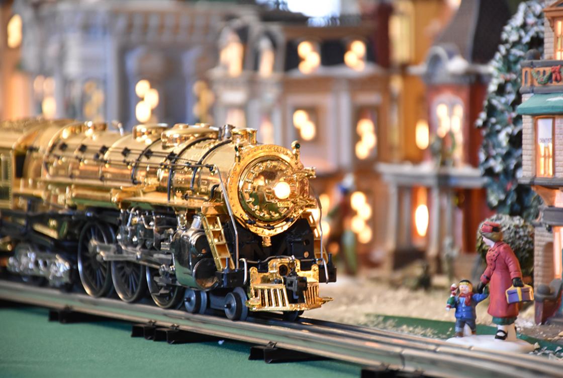Photograph of a gold lionel train at Cranbrook House during Holiday Splendor 2018.