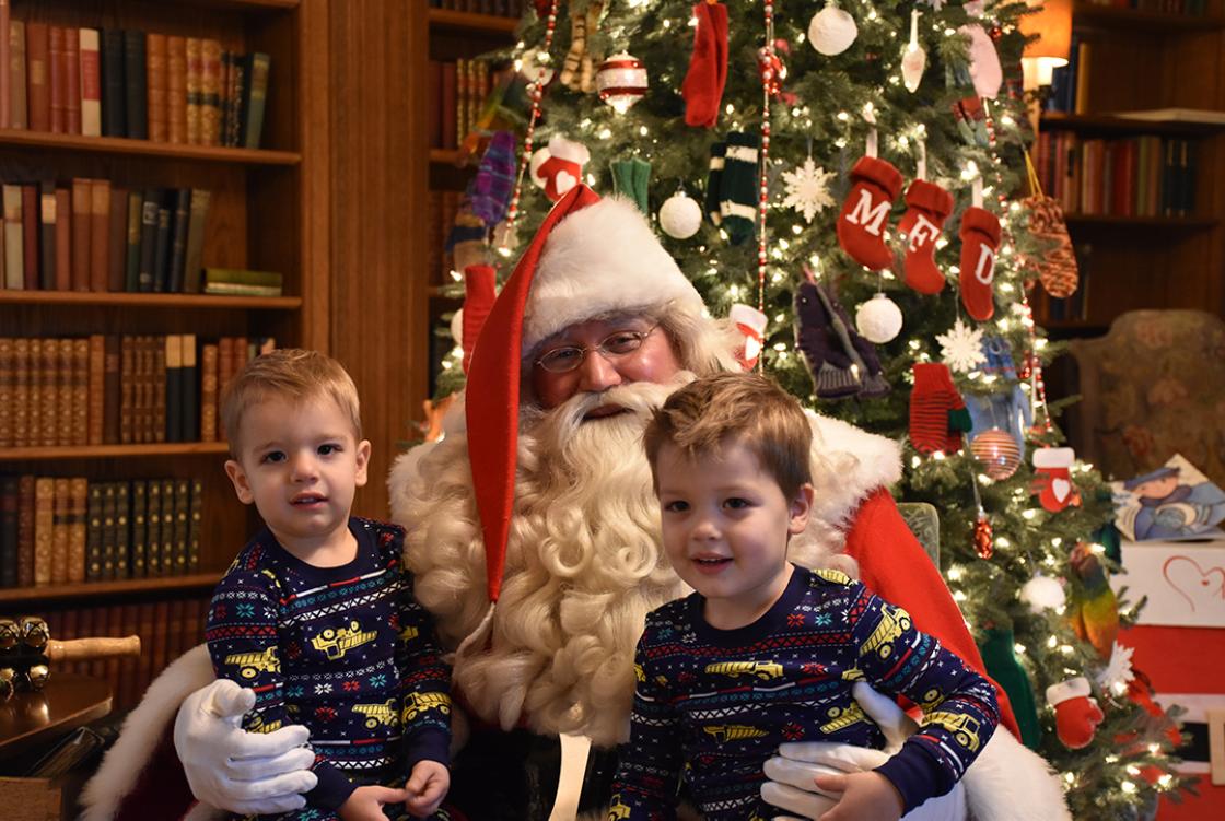 Photograph of two boys with Santa during Holiday Splendor at Cranbrook House, December 2018.