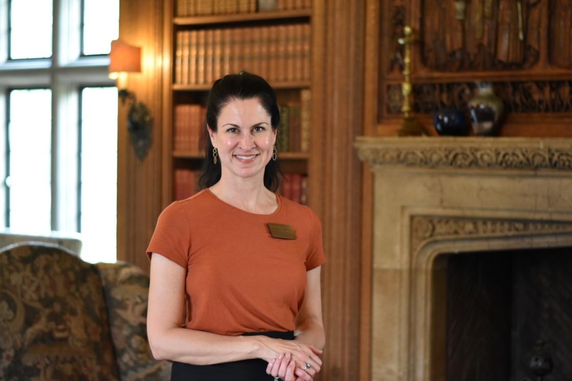 Photo of a docent in the Cranbrook House Library.