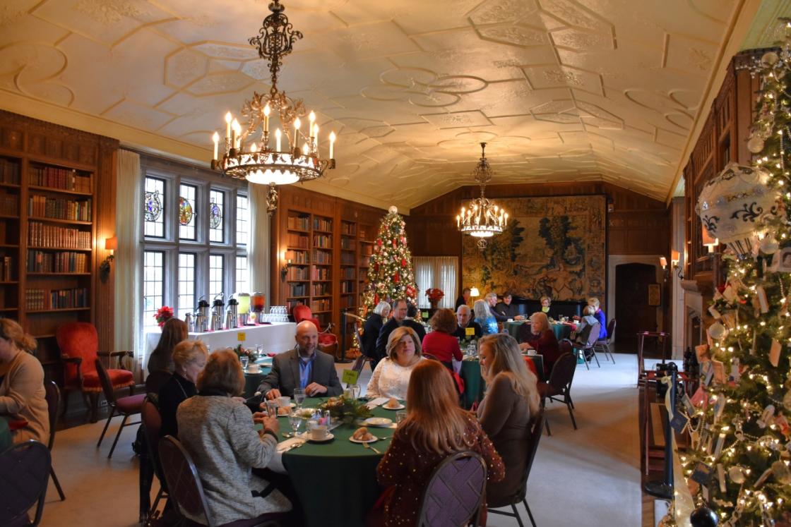 Photograph of guests having tea during the holidays at Cranbrook House.