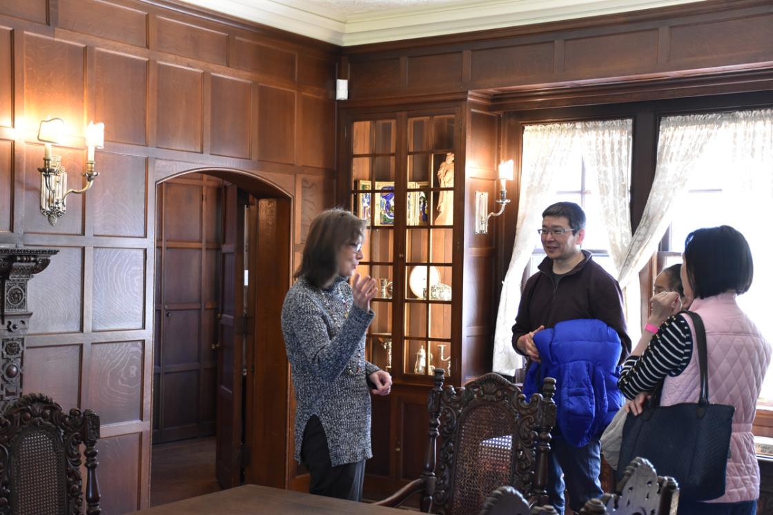 A docent with a group of guests in the Cranbrook House Dining Room, April 2019.