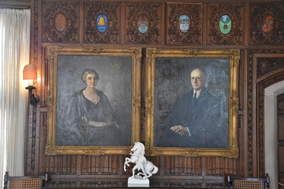 Photograph of portraits of Ellen Scripps Booth and George Gough Booth in the Cranbrook House Oak Room.