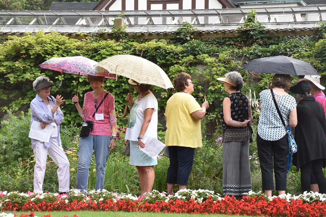 Photograph of Digging Deeper 2018 guests in the Sunken Garden at Cranbrook House & Gardens.