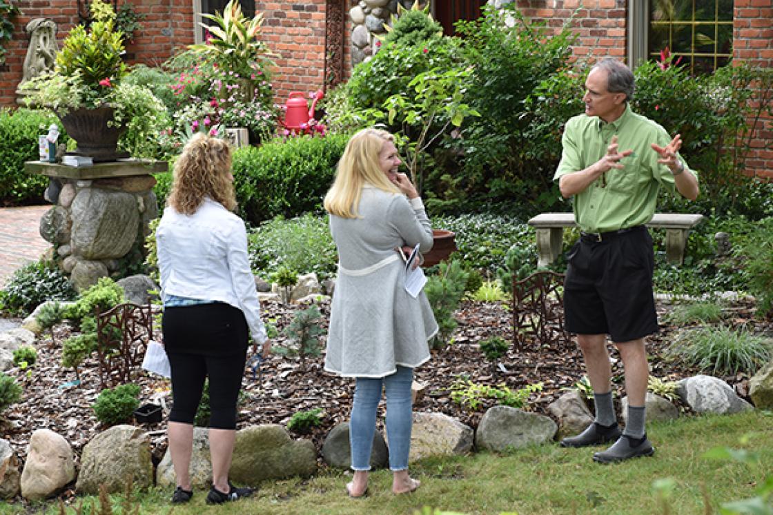 Photograph of three visitors at the Cranbrook & Friends Garden Walk.