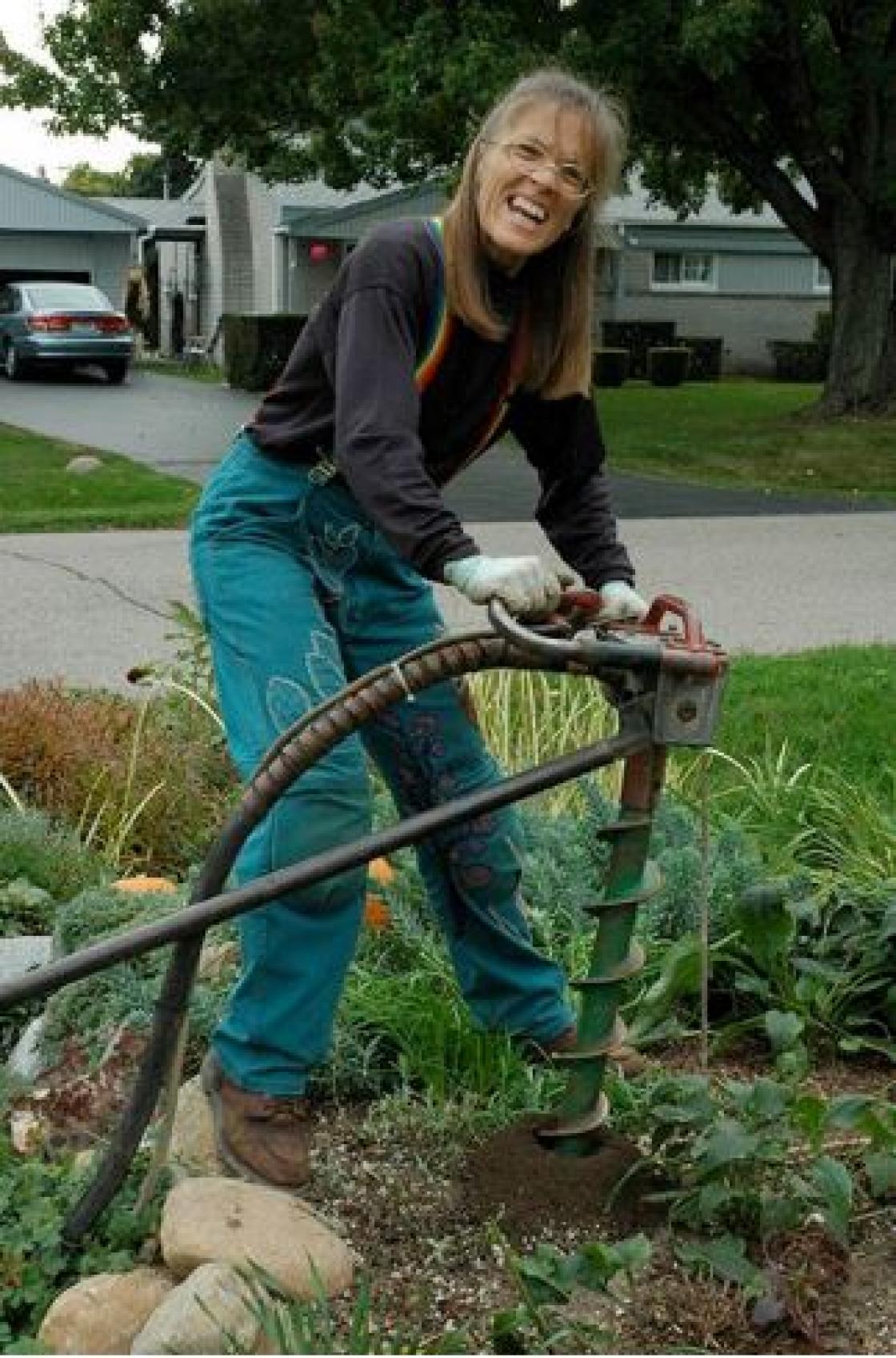 Photograph of Janet Macunovich with a jackhammer 
